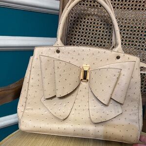 Crossi NEW YORK Elegant Cream Bow Handbag- make an offer